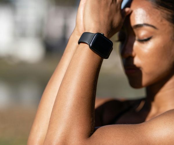 Close-up of a person's calm face with eyes closed, focusing on breathing.